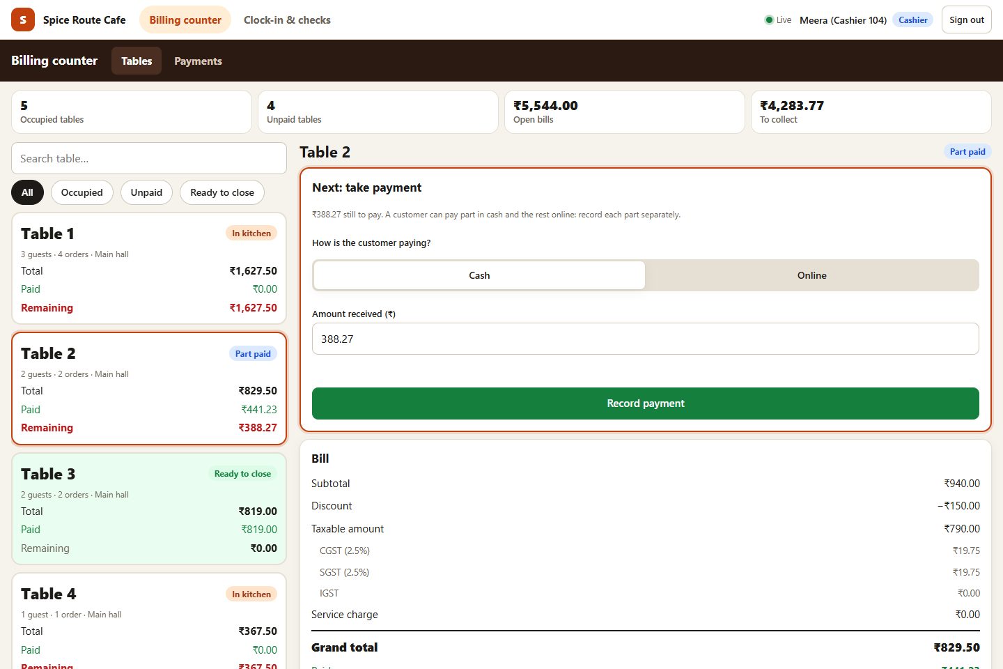 The billing counter showing open tables and bills